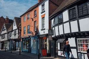A shot of the outside of independent shops in Tudor buildings in the Shambles road.