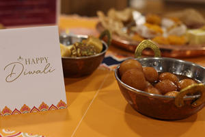 a close up of a diwali dish and a card that says "happy Diwali"