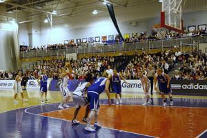 Basketball players set-up a shot