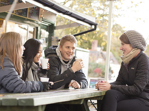 Students drink coffee outdoors