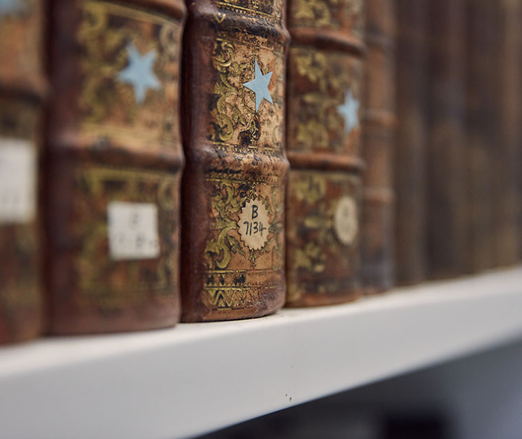 Close up of old books on a shelf
